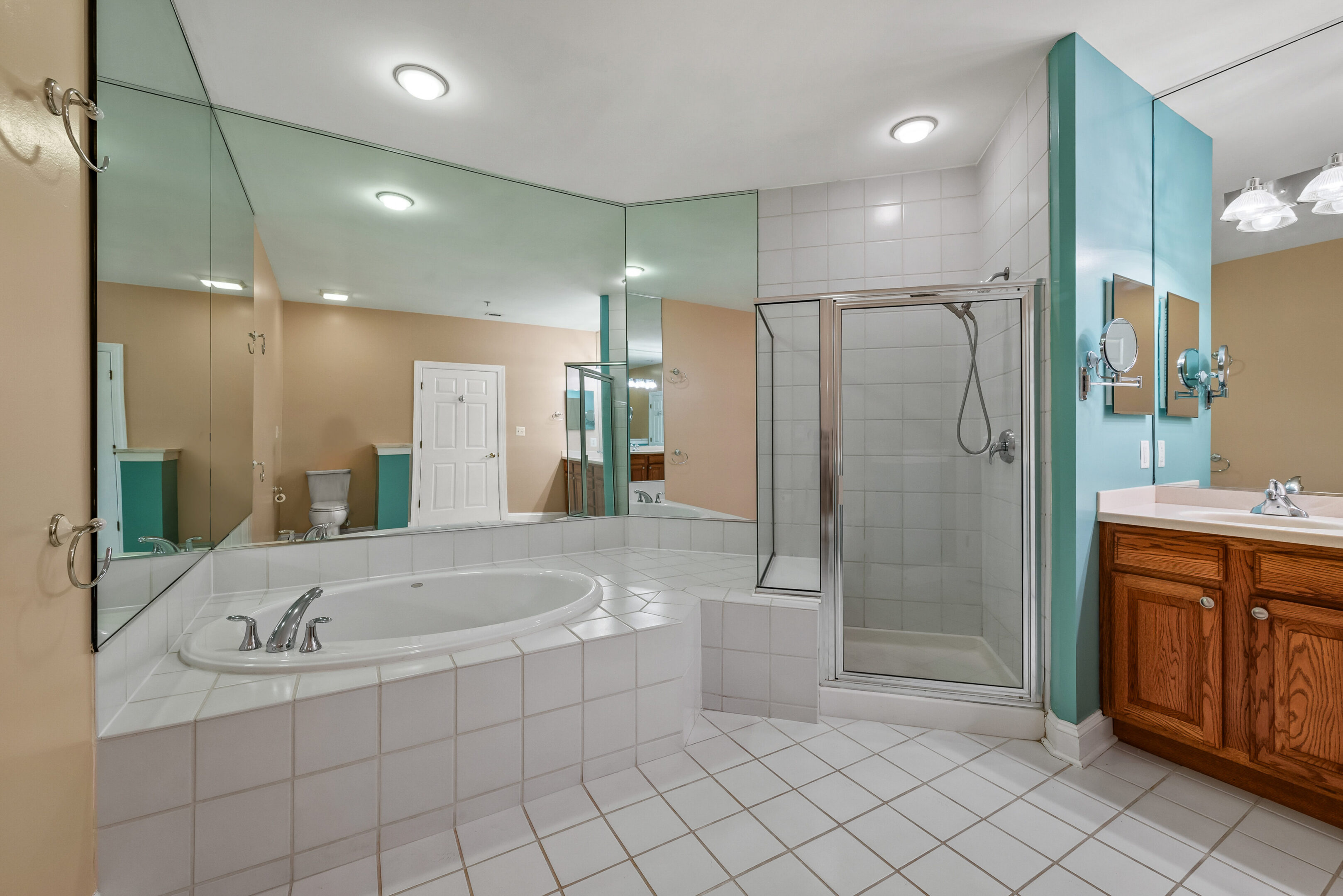 Spacious bathroom with large mirrors
