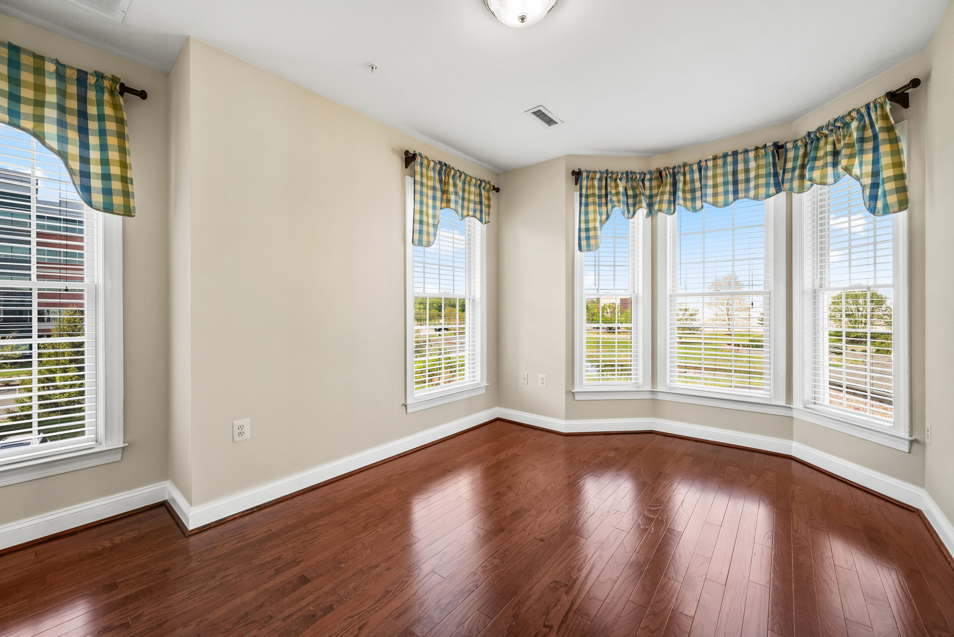 Sunlit room with wooden floor